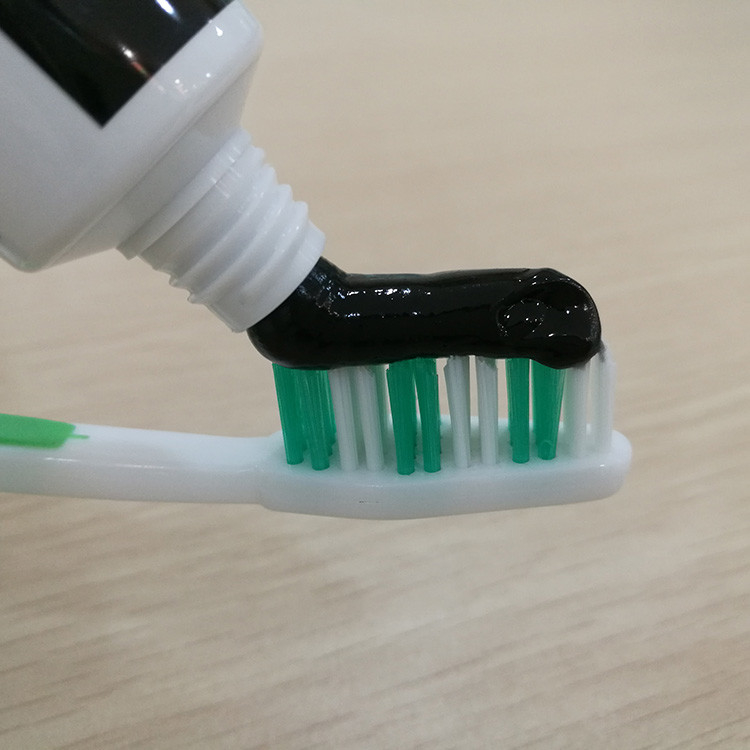 Les dents de GMP blanchissant la brosse à dents de pâte dentifrice ont placé les extraits de fines herbes organiques de graine de cumin de noir de Miswak