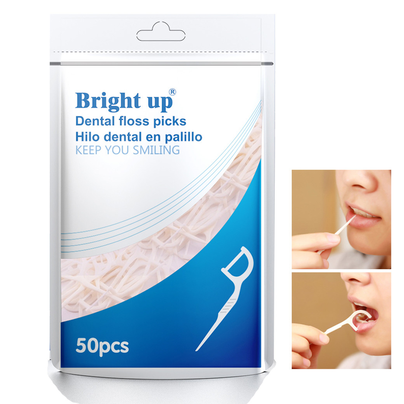 La boîte de fil dentaire ou le fil dentaire biodégradable de fines herbes sélectionnent le soin oral vous gardent sourire
